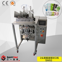 Double head filling and sealing mask machine
